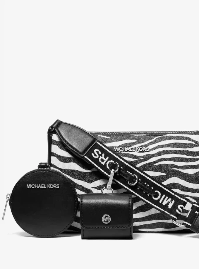Bolso bandolera Jet Set Leather mediano con estampado animal y logotipo, con estuche para Apple AirPods Pro®.