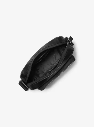 Bolso bandolera para cámara con el logotipo de Cooper Signature y bolsa