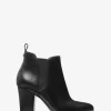 Bota con ribete del logotipo de la firma Evaline Bota con ribete del logotipo de la firma Evaline