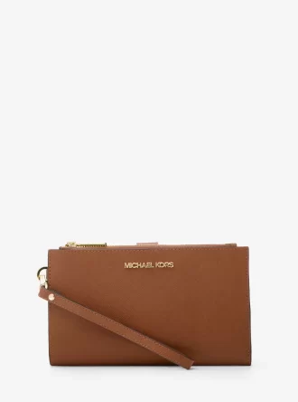 Cartera de piel grande para smartphone Jet Set con correa de muñeca Cartera de piel grande para smartphone Jet Set con correa de muñeca