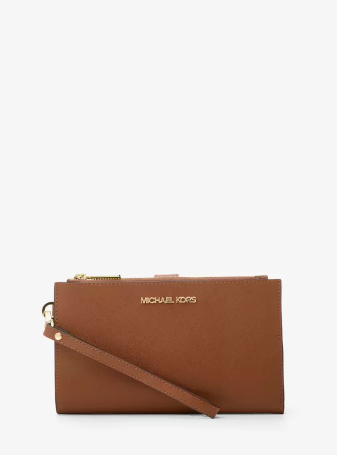 Cartera de piel grande para smartphone Jet Set con correa de muñeca