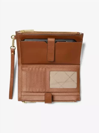 Cartera de piel grande para smartphone Jet Set con correa de muñeca Cartera de piel grande para smartphone Jet Set con correa de muñeca
