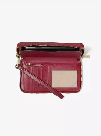 Cartera grande para smartphone con rayas metálicas y el logotipo de la firma Jet Set