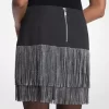 Minifalda con flecos y tachuelas