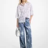 Pantalón vaquero ancho de mezclilla desteñida con salpicaduras de color a mano