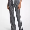 Pantalones deportivos de punto elástico metalizado con estampado de logotipo Pantalones deportivos de punto elástico metalizado con estampado de logotipo