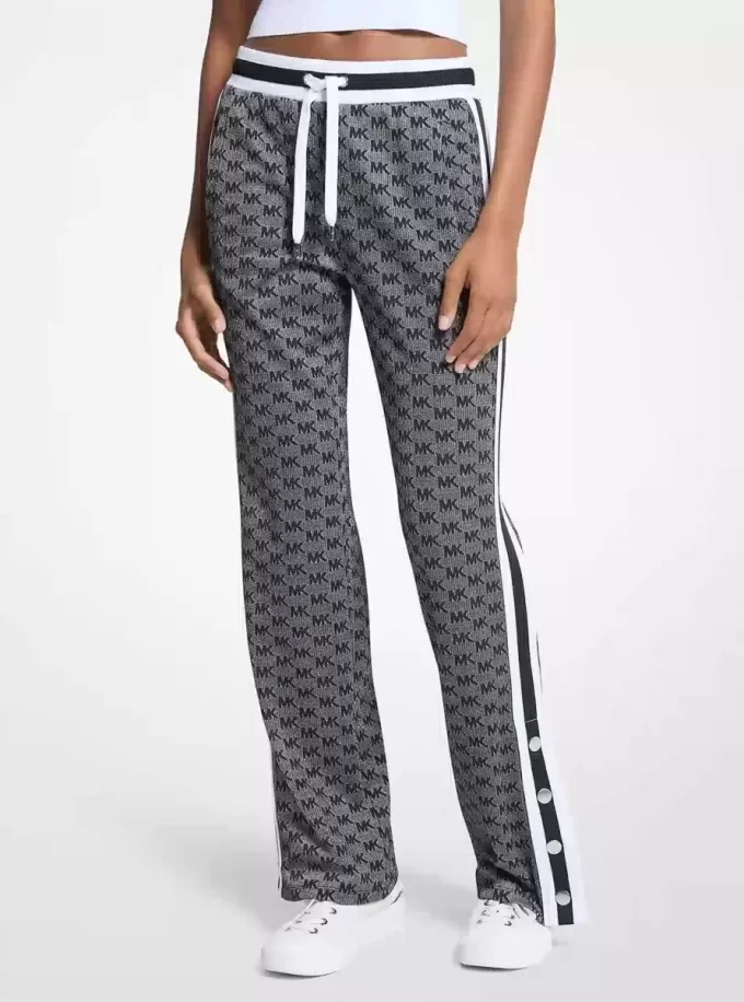 Pantalones deportivos de punto elástico metalizado con estampado de logotipo Pantalones deportivos de punto elástico metalizado con estampado de logotipo