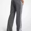 Pantalones deportivos de punto elástico metalizado con estampado de logotipo Pantalones deportivos de punto elástico metalizado con estampado de logotipo