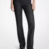 Pantalones pitillo vaqueros elásticos con tachuelas Pantalones pitillo vaqueros elásticos con tachuelas