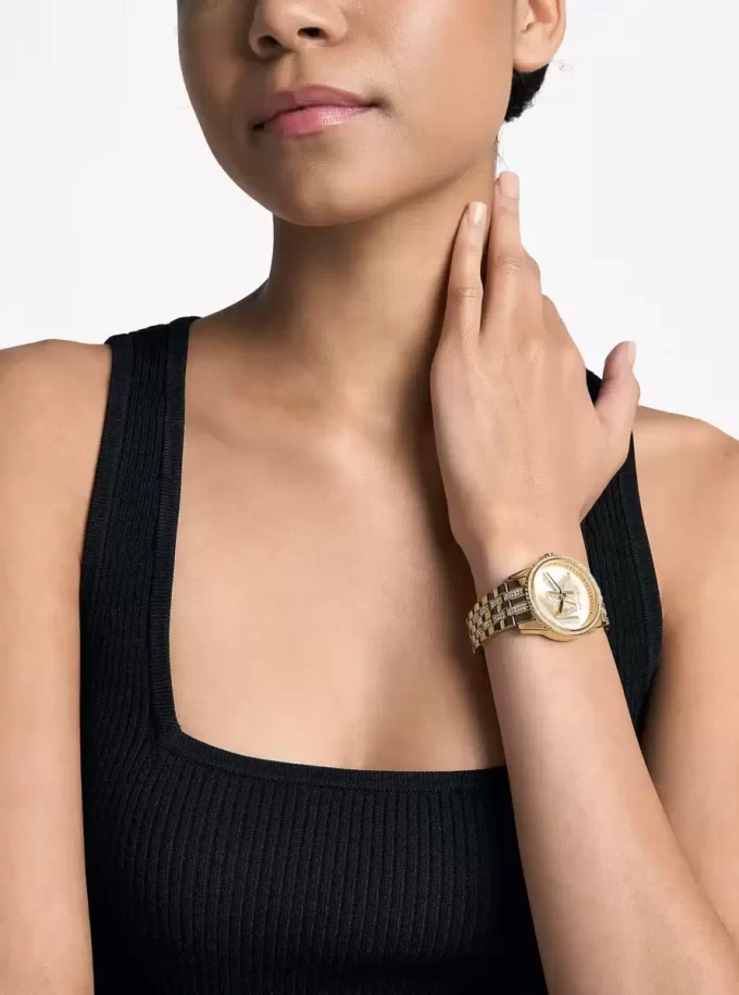 Reloj Mini Bryant con logotipo pavé en tono dorado