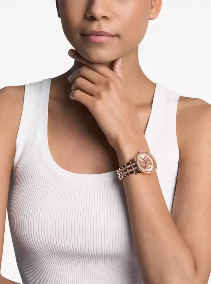 Reloj Mini Bryant con logotipo pavé en tono oro rosa