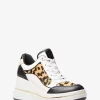 Zapatillas de cuña Emmy de piel y pelo de becerro con estampado de leopardo Zapatillas de cuña Emmy de piel y pelo de becerro con estampado de leopardo