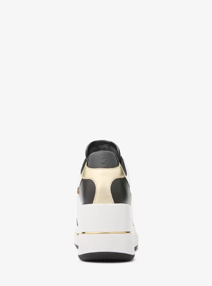Zapatillas de cuña Emmy de piel y pelo de becerro con estampado de leopardo Zapatillas de cuña Emmy de piel y pelo de becerro con estampado de leopardo